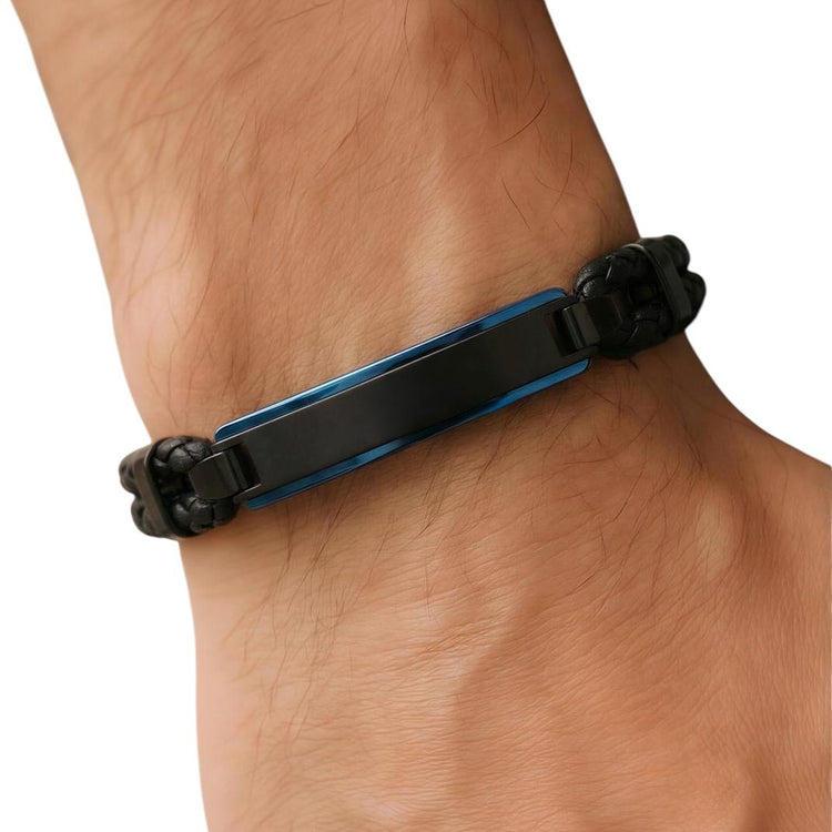 Close-up of a wrist wearing a black and blue bracelet on a white background
