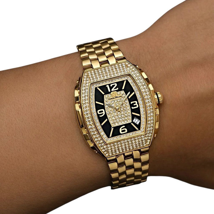 Gold wristwatch with black face on a wrist against a white background