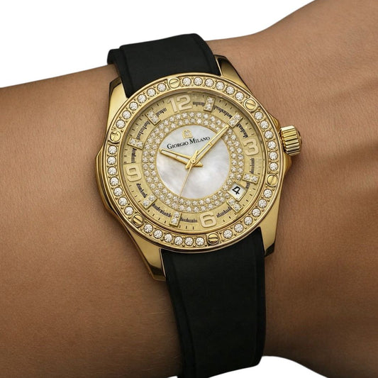 Gold wristwatch with black strap on a wrist against a white background